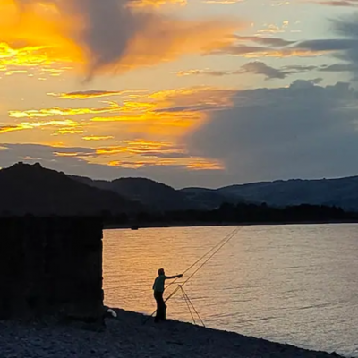 Sunset View With Fisherman